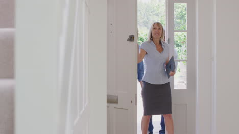 couple viewing potential new home with female realtor