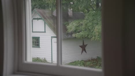 a window view of a house with a star on it