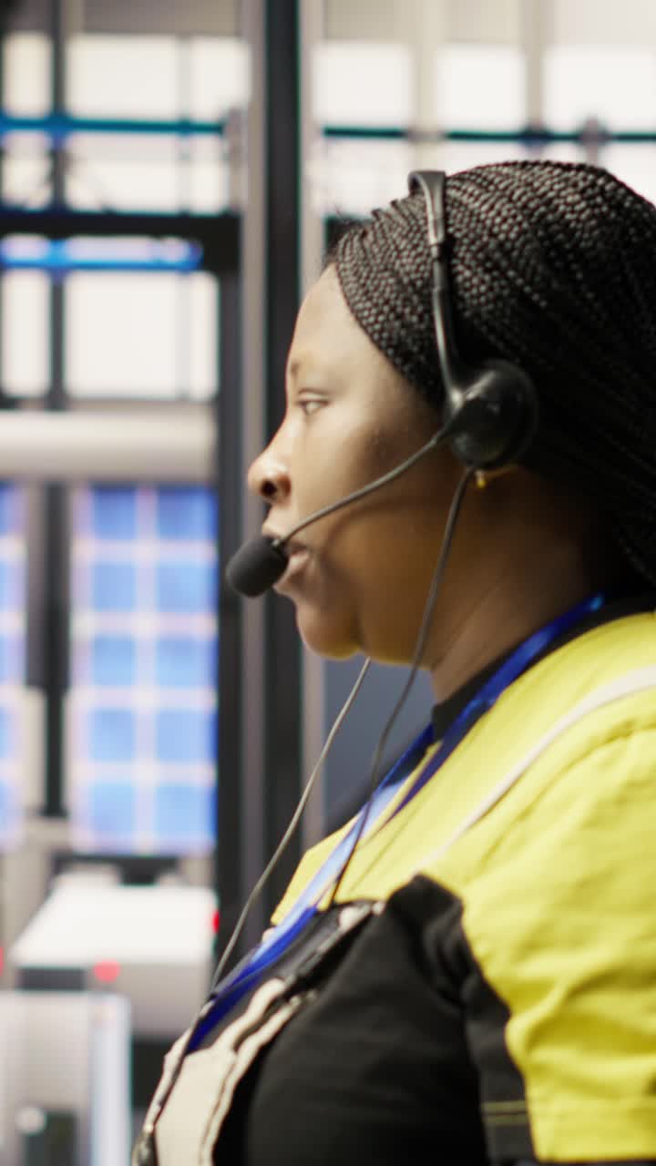 Vertical video Call center agent in smart factory using headset to assist with maintenance