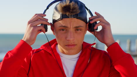 teen with headphones, beach and travel with music