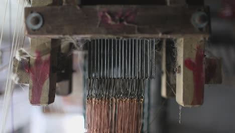 close-up view of the wooden machine used for weaving in sri lankan village for making and stitching mats or clothes