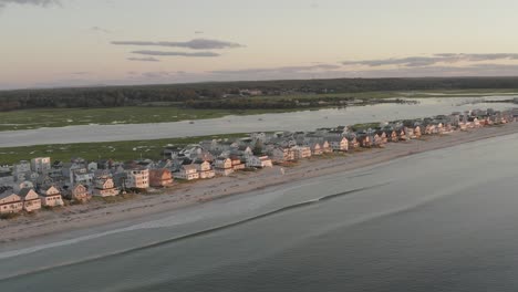 wide aerial view housing property along wells beach seaside shoreline, maine