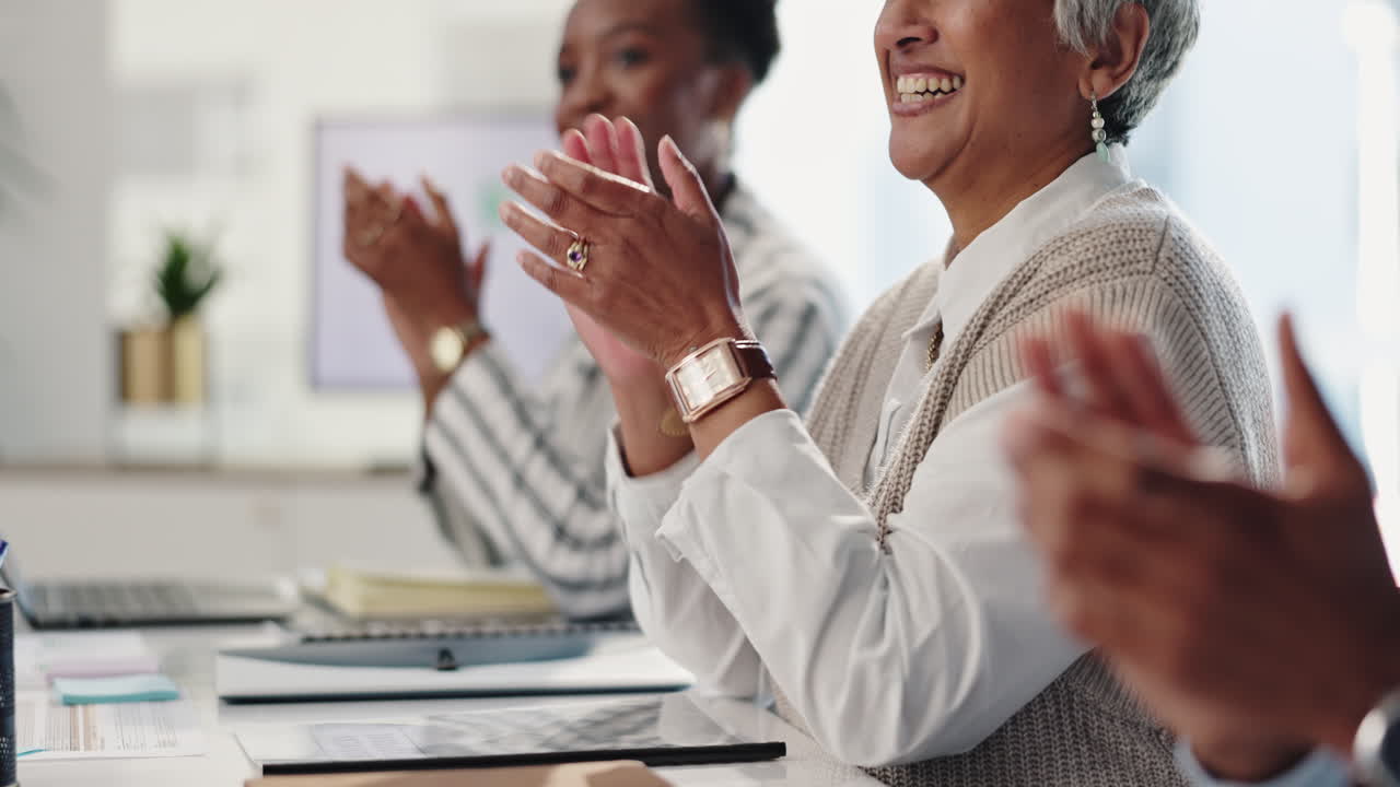 Business people clapping in a meeting