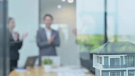 team of asian business people clapping and applause at meeting the annual sales of housing estate sales, success teamwork or corporate of real estate