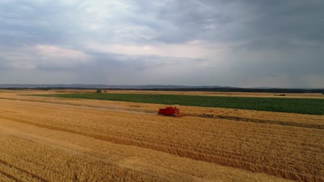 drone view of combine harvester on the field