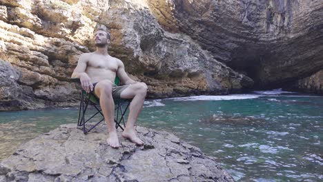 young man in a bay on a summer day.