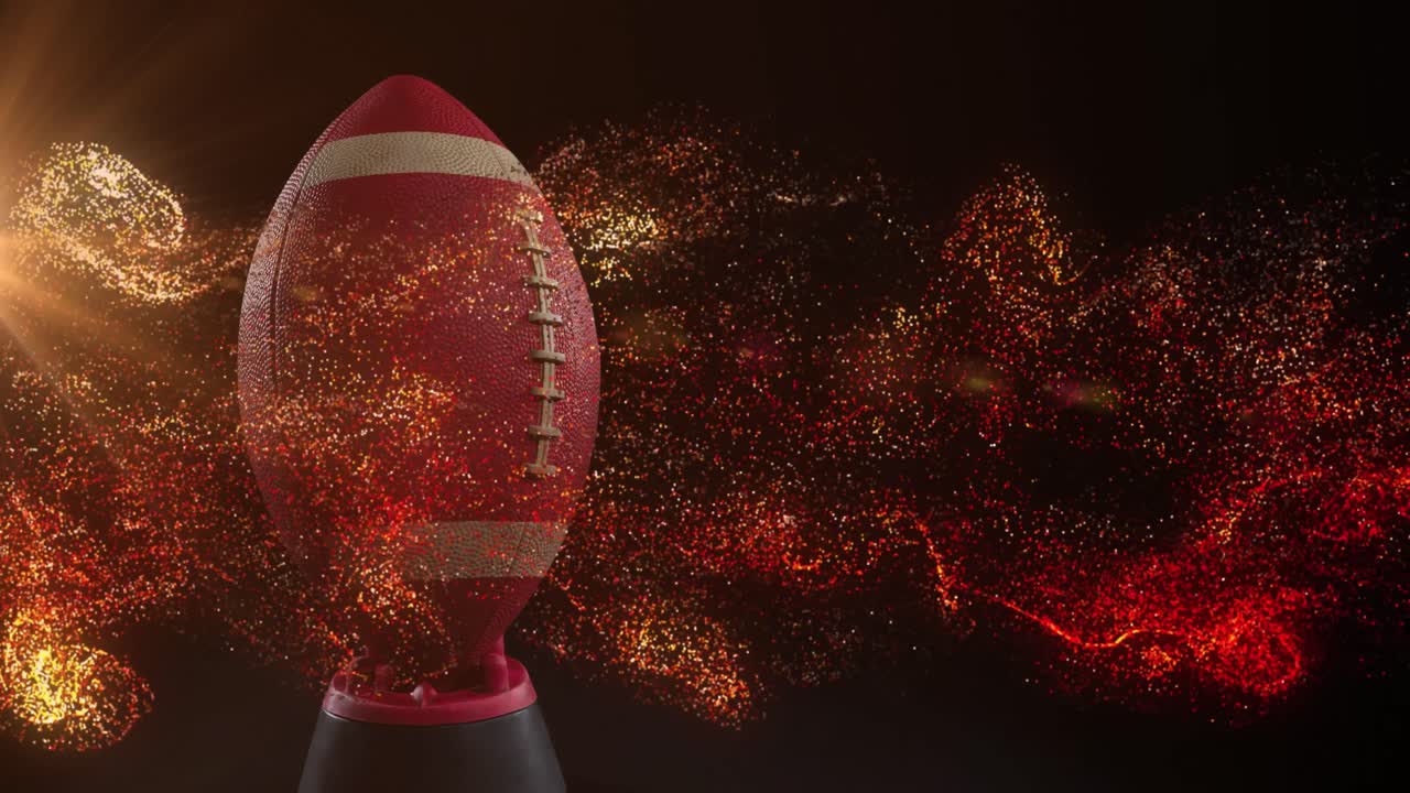Animazione di particelle arancioni luminose che si muovono su una palla da rugby