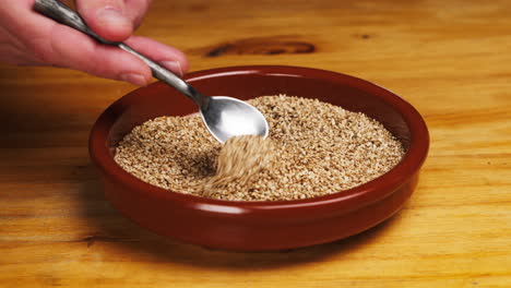 white dried sesame seeds close-up macro. super food. sprinkles for food.healthy concept. high quality 4k footage