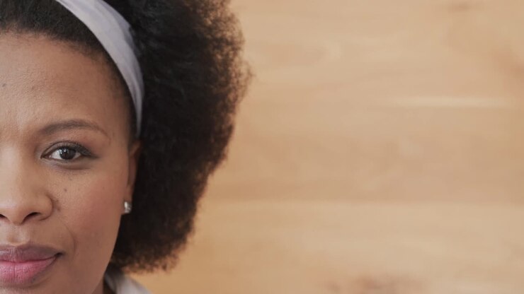 Portrait of happy african american plus size woman smiling, unaltered, copy space, slow motion