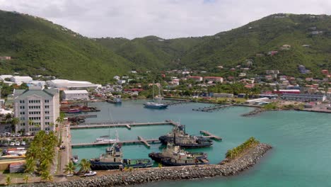 orbiting drone shot showing port on caribbean island