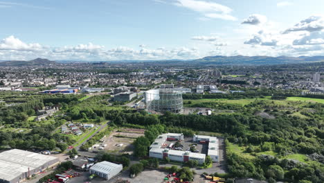 4K-Wide-Slow-Aerial-of-Granton-Gasholder-under-construction,-Edinburgh,-The-Capital-of-Scotland,-United-Kingdom