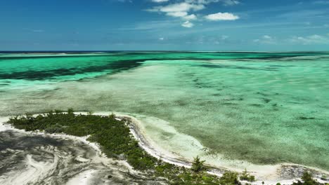 colorful bahamas water, static aerial view of turquoise, aqua, and blue ocean flats