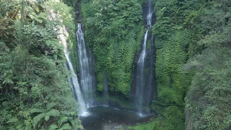 three falls waterfall flows down steep jungle cliff, sekumpul bali