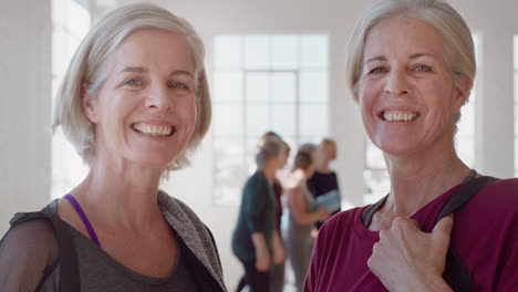 portrait beautiful old women twin sisters enjoying yoga class smiling happy middle aged siblings practice healthy fitness lifestyle in workout studio