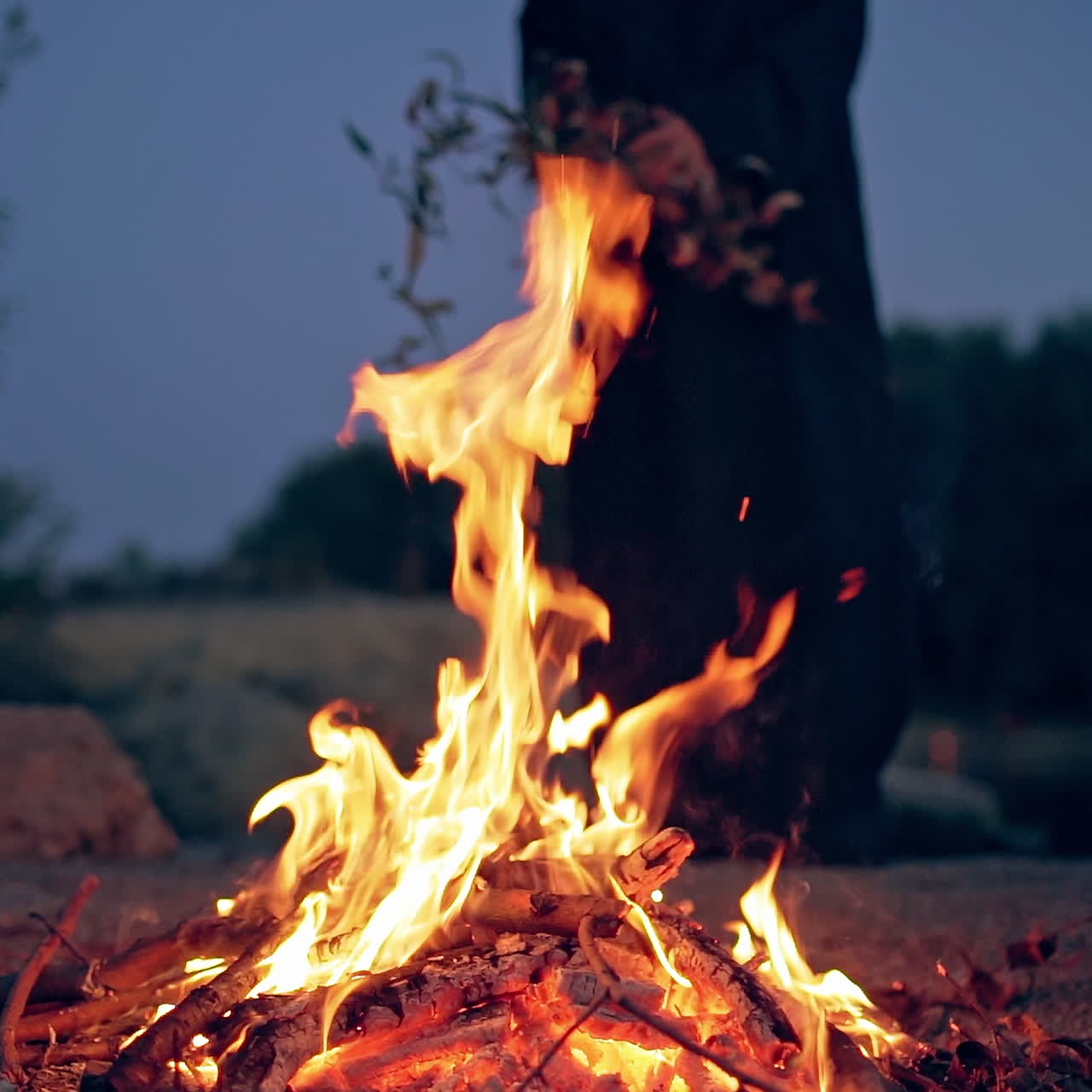 Old evil witch brewing magic potion. Halloween. Burning fire.
