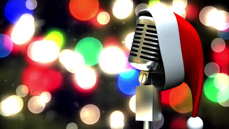 santa hat over microphone against colorful spots of light against black background