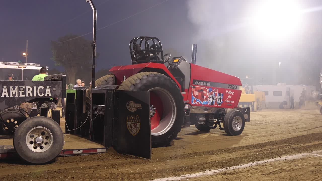 Tractor unhooking from pulling sled