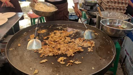 cooking oyster omelet on large pan