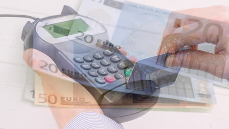 animation of euro banknotes falling over hand of caucasian man holding payment terminal