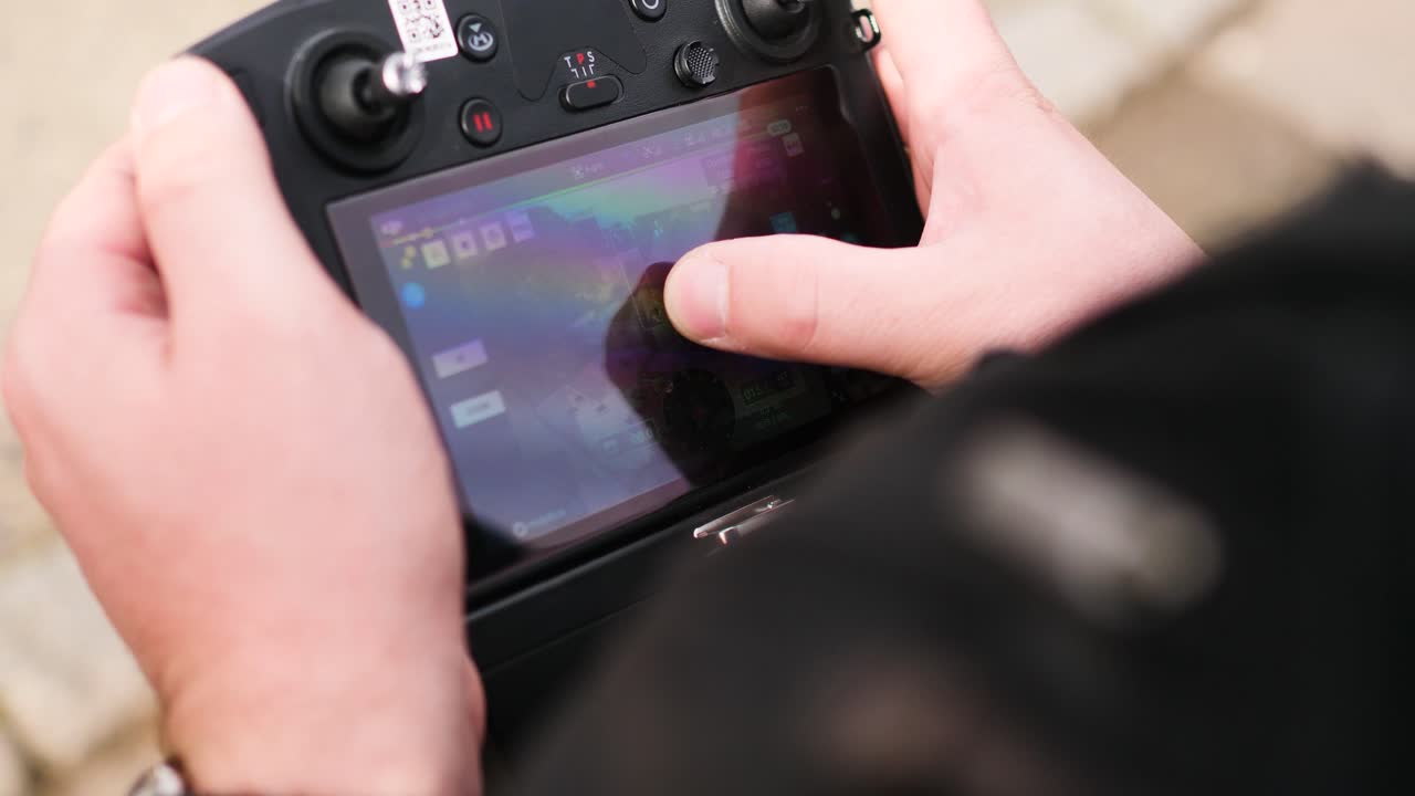Man controlling a drone on a construction stie
