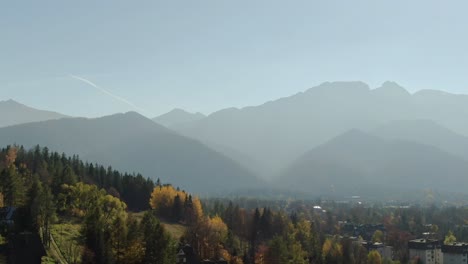 majestic tatra mountains range and zakopane city, poland in hazy autumn sunlight