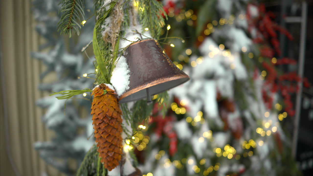Christmas fir tree with decoratons bells outside and white snow