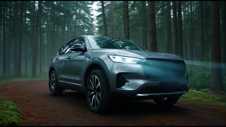 Silver SUV Driving Through a Misty Forest Road