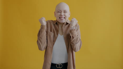 happy bald woman celebrating