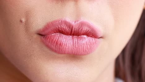 close-up of lipstick application on lips