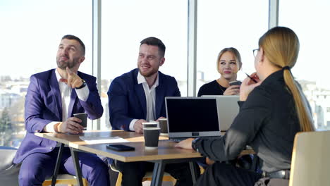 professional friendly business discussion. happy business people enjoying working together at office