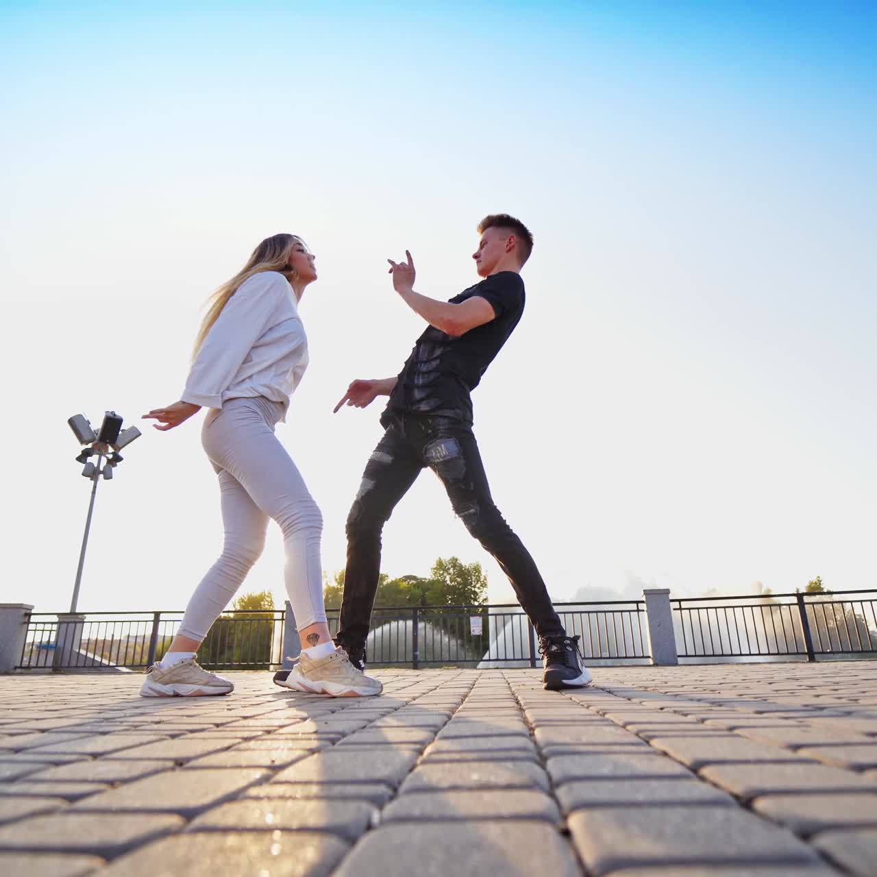 Dancing couple near fountain