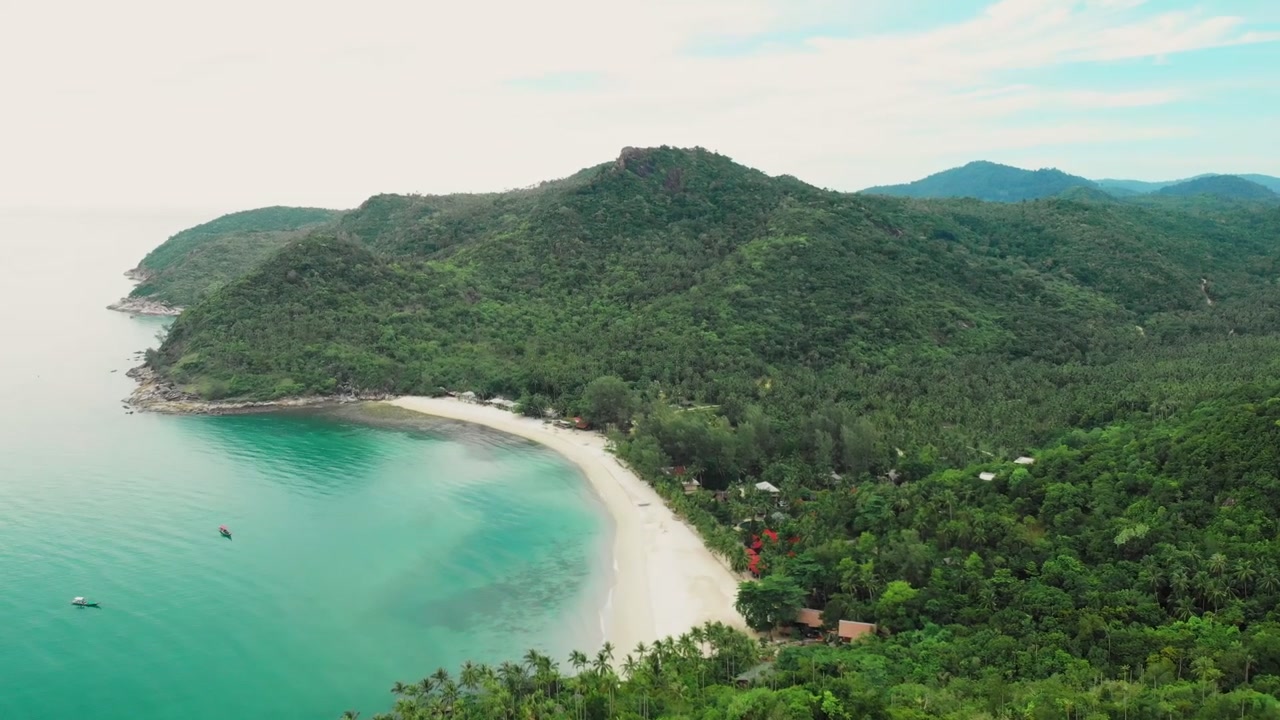 Aerial View of Tropical Beach and Lush Green Mountains