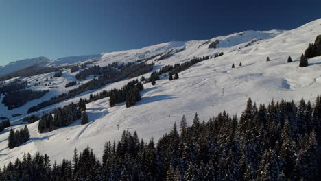 uphill view of winter landscape on reiterkogel mountain in hinterglemm, austria