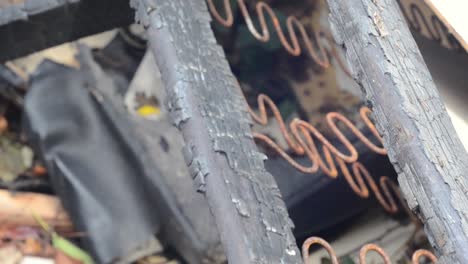 burnt out bed and ashes after house fire