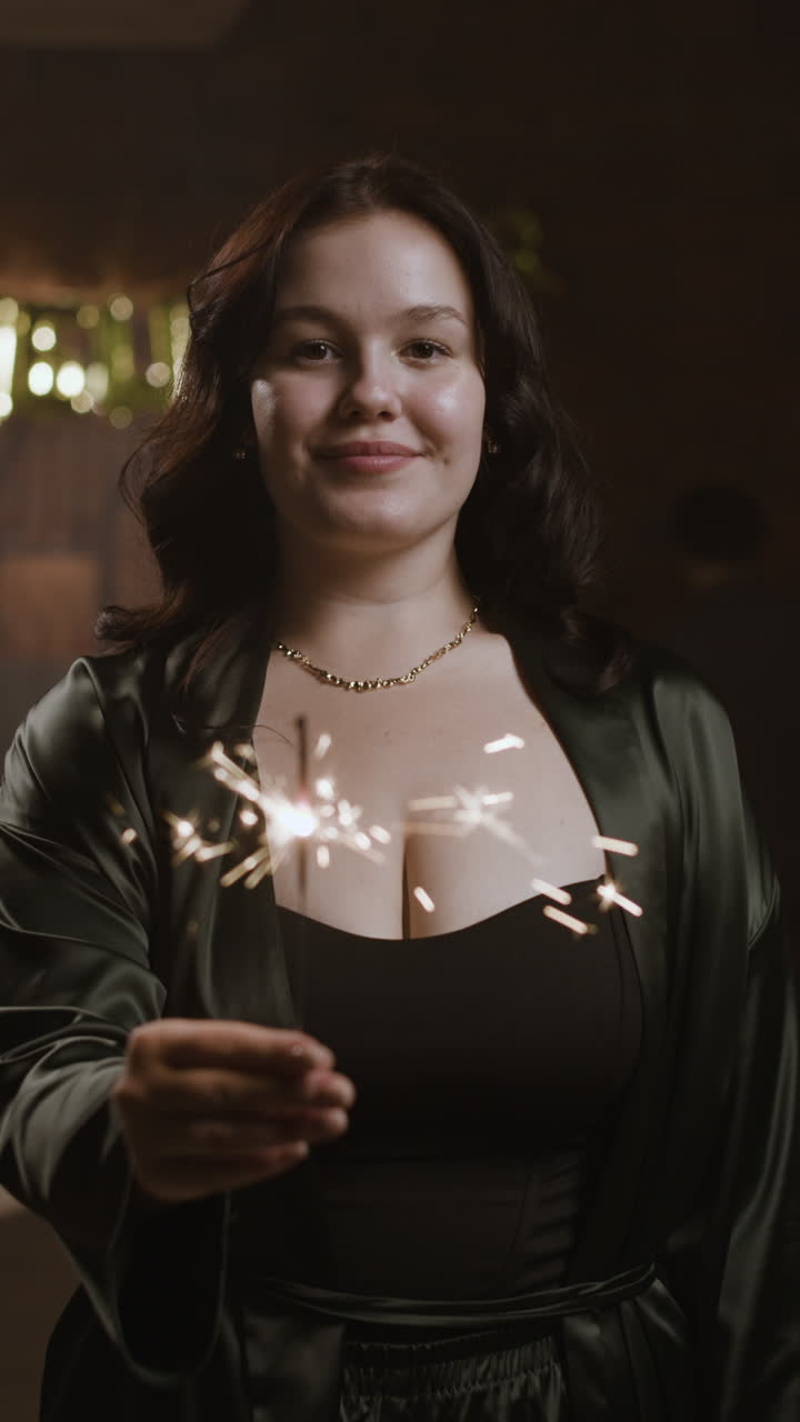 Woman celebrating with sparkler