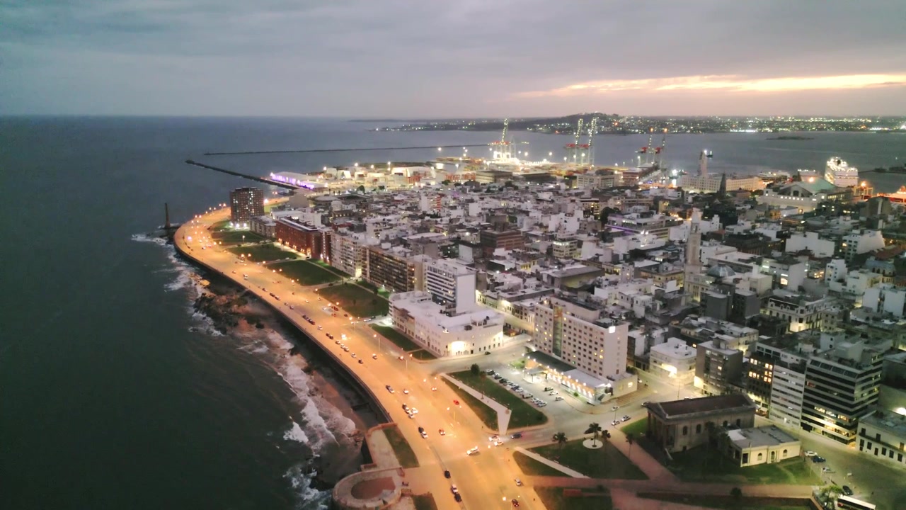 Montevideo Uruguay aerial illuminated at night cityscape with port and traffic road skyline