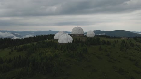 drone circling around abandoned soviet union radar station surrounded by spectacular landscape