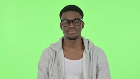 african man waving, welcoming on green background
