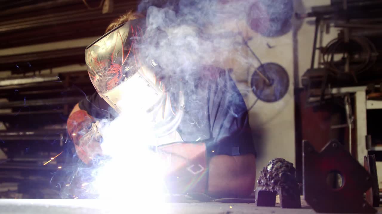 Welder working on a piece of metal