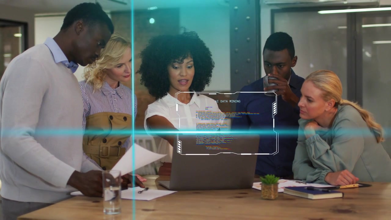 Lead woman pointing at laptop and guiding business team causing blue HUDs highlighting project data