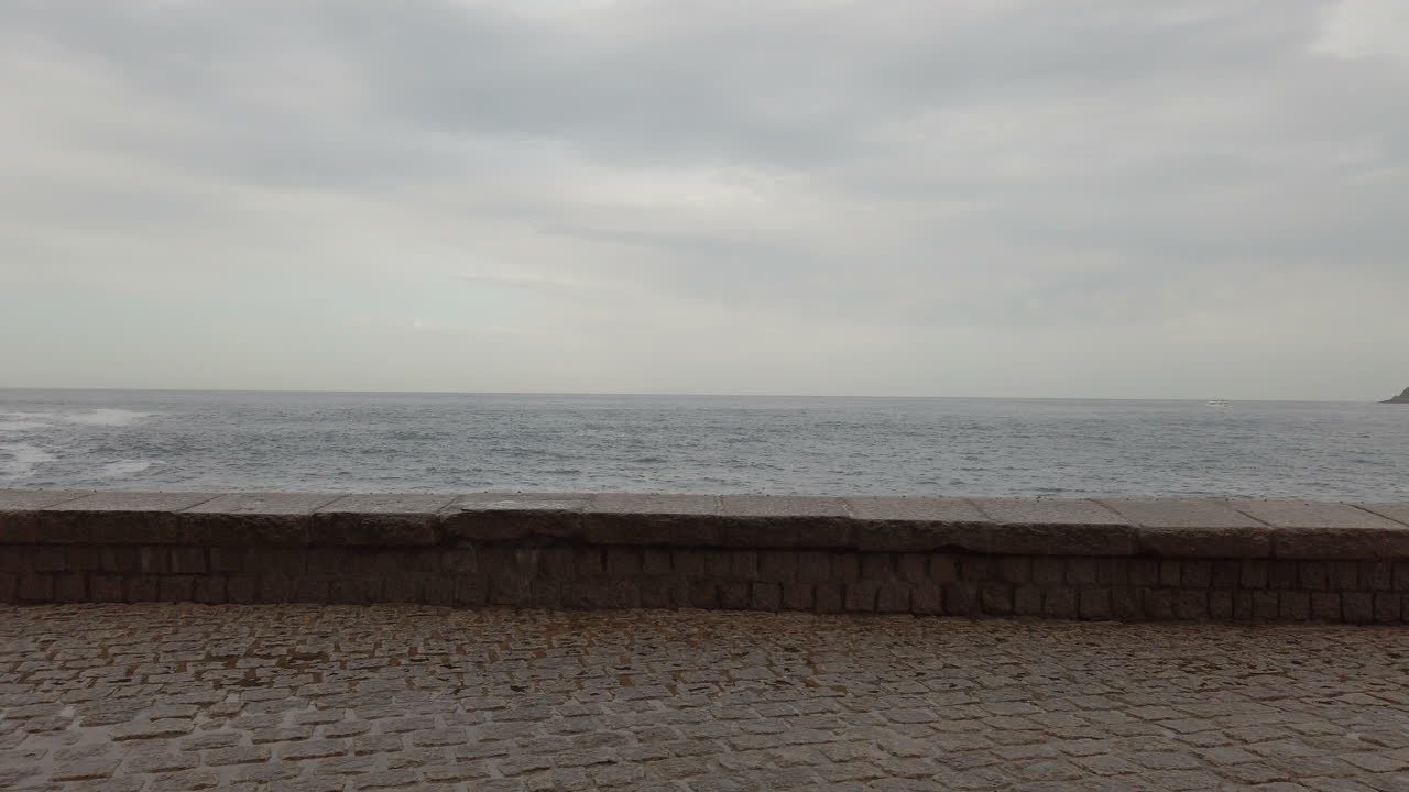 Waves crashing against a seawall