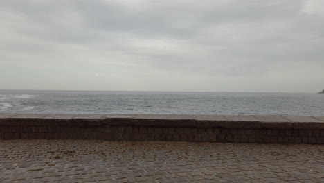 waves crashing against a seawall