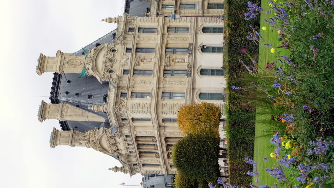 Paris, France - November 21, 2021: Front view of the Louvre Museum on a cloudy day. Vertical
