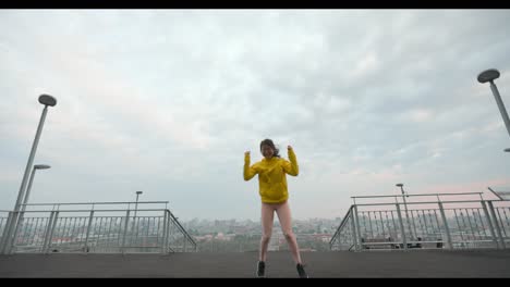 woman dancing on urban terrace