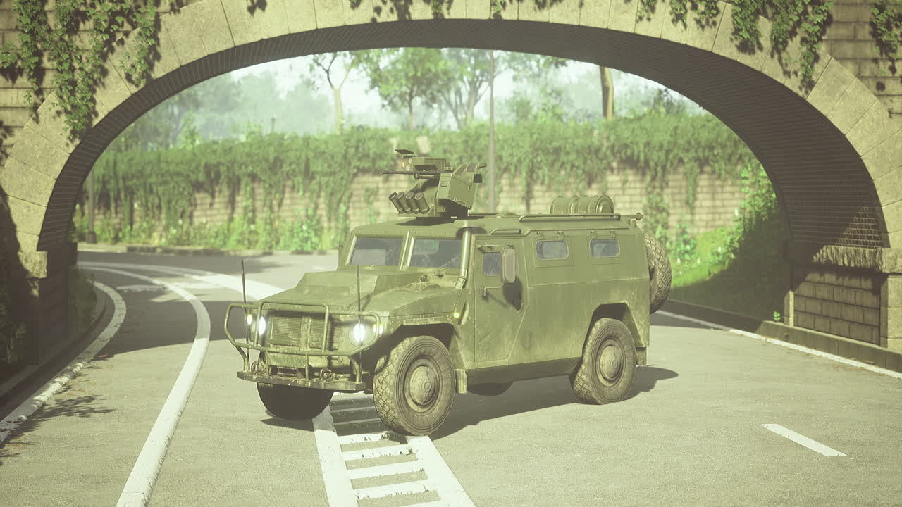 Military vehicle navigating a winding road under a stone archway