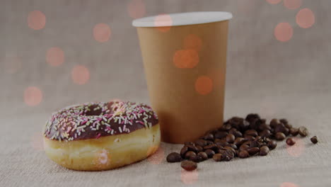 animación de café y rosquilla sobre puntos de luz