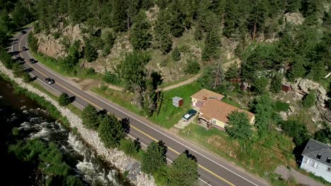 Mountains-and-a-road-in-a-drone-pan-framed-by-two-tripod-shots