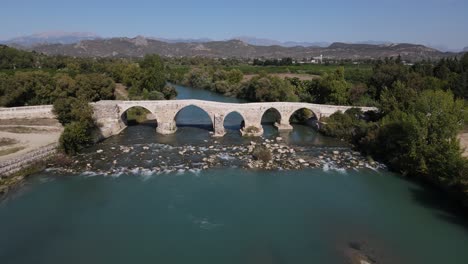 stone bridge over green river