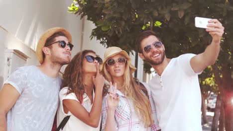 Smiling-hipster-friends-taking-selfie