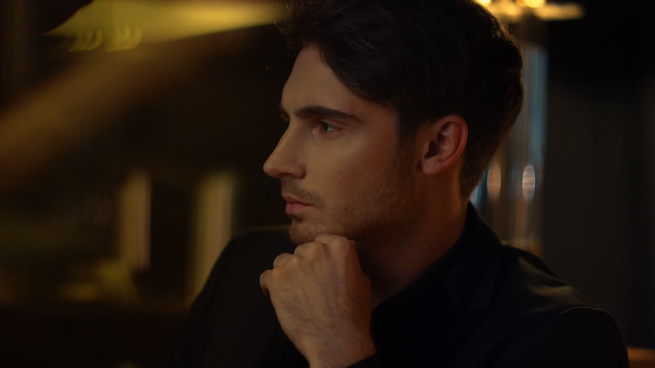 Thoughtful man looking aside indoors